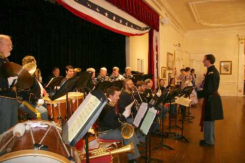 The band prepares to break and watch Mr. Lincoln cut his birthday cake in the State Dining room.
